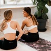 lifestyle image of young women doing a yoga pose